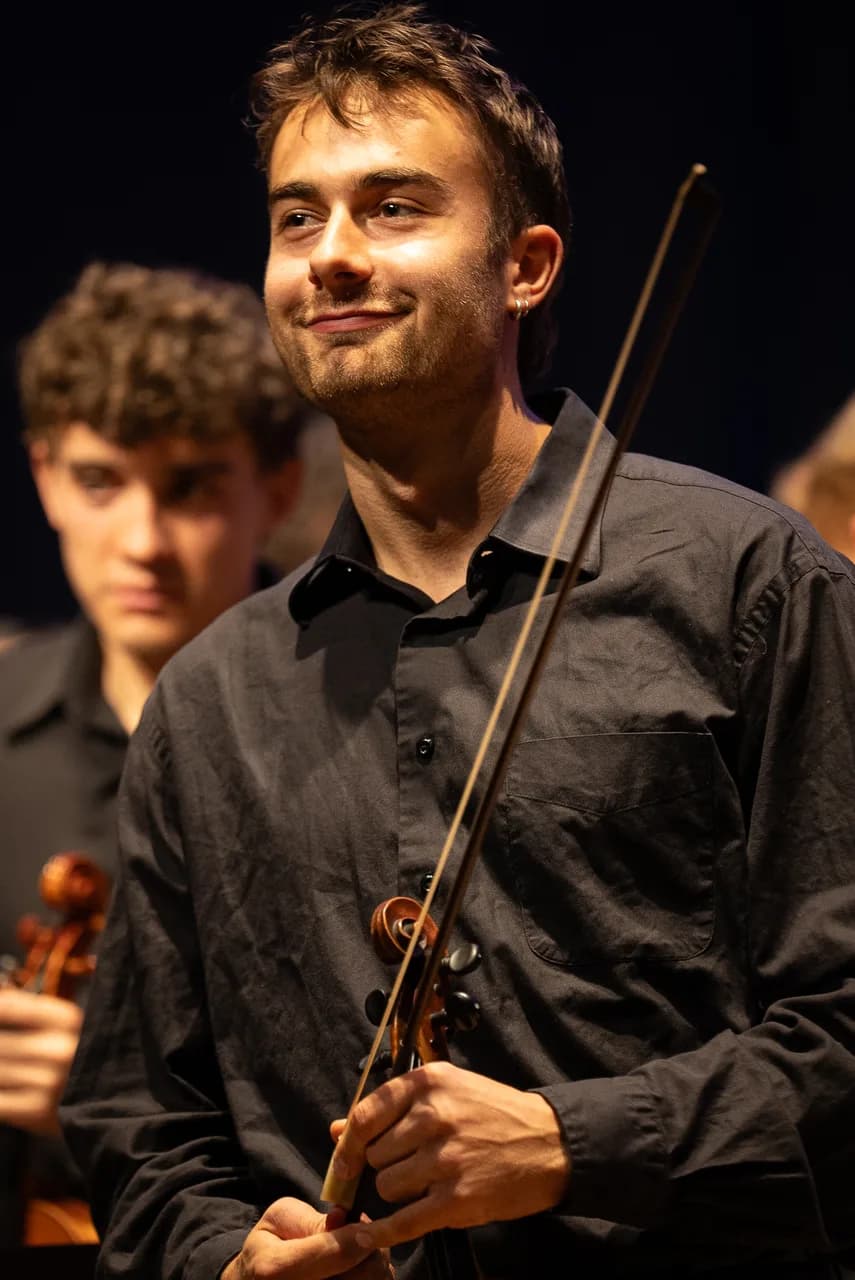 Portrait of a violinist holding a bow
